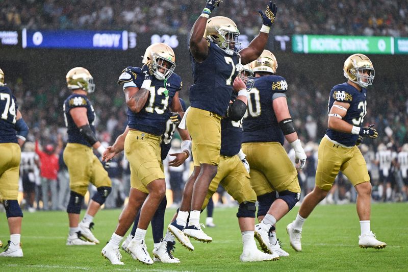 Aug 26, 2023; Dublin, IRL; Notre Dame Fighting Irish running back Audric Estime (7) celebrates after a first quarter touchdown against the Navy Midshipmen at Aviva Stadium. Mandatory Credit: Matt Cashore-USA TODAY Sports