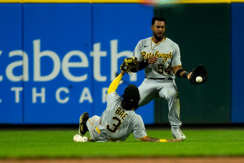 Sep 23, 2023; Cincinnati, Ohio, USA; Pittsburgh Pirates right fielder Joshua Palacios (54) grabs a baseball as second baseman Ji Hwan Bae (3) slides in the eighth inning against the Cincinnati Reds at Great American Ball Park. Mandatory Credit: The Cincinnati Enquirer-USA TODAY Sports