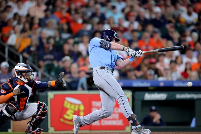 Jul 30, 2023; Houston, Texas, USA; Tampa Bay Rays left fielder Luke Raley (55) hits an RBI infield single against the Houston Astros during the first inning at Minute Maid Park. Mandatory Credit: Erik Williams-USA TODAY Sports