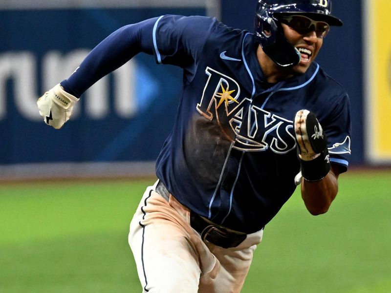 Jun 11, 2024; St. Petersburg, Florida, USA; Tampa Bay Rays second base Richie Palacios (1) heads for home to score a run in the ninth inning against the Chicago Cubs at Tropicana Field. Mandatory Credit: Jonathan Dyer-USA TODAY Sports