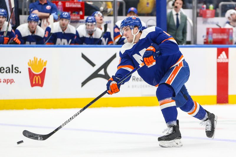 Feb 24, 2024; Elmont, New York, USA;  New York Islanders defenseman Ryan Pulock (6) attempts a shot on goal in the second period against the Tampa Bay Lightning at UBS Arena. Mandatory Credit: Wendell Cruz-USA TODAY Sports