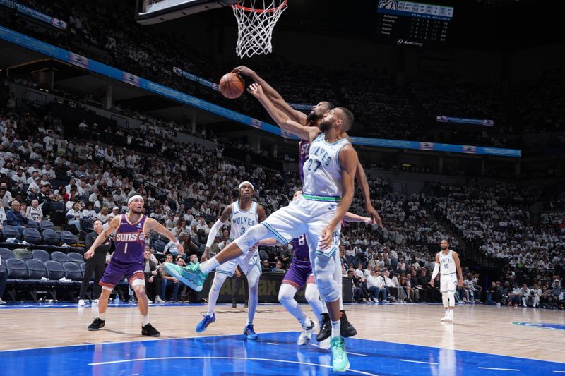 MINNEAPOLIS, MN -  APRIL 23: Rudy Gobert #27 of the Minnesota Timberwolves and Kevin Durant #35 of the Phoenix Suns go up for the rebound during the game during Round One Game Two of the 2024 NBA Playoffs on April 23, 2024 at Target Center in Minneapolis, Minnesota. NOTE TO USER: User expressly acknowledges and agrees that, by downloading and or using this Photograph, user is consenting to the terms and conditions of the Getty Images License Agreement. Mandatory Copyright Notice: Copyright 2024 NBAE (Photo by Jordan Johnson/NBAE via Getty Images)