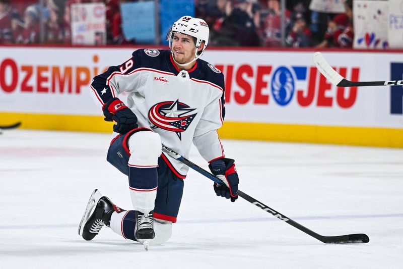 Mar 12, 2024; Montreal, Quebec, CAN; Columbus Blue Jackets right wing Yegor Chinakhov (59) kneels on the ice during warm-up before the game against the Montreal Canadiens at Bell Centre. Mandatory Credit: David Kirouac-USA TODAY Sports