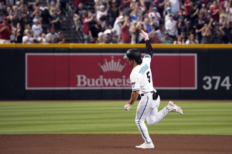 Jul 8, 2023; Phoenix, Arizona, USA; Arizona Diamondbacks center fielder Alek Thomas (5) runs the bases after hitting a solo home run against the Pittsburgh Pirates during the eighth inning at Chase Field. Mandatory Credit: Joe Camporeale-USA TODAY Sports