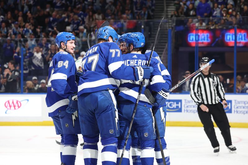 Dec 6, 2023; Tampa, Florida, USA; Tampa Bay Lightning center Anthony Cirelli (71) is congratulated by right wing Nikita Kucherov (86) , defenseman Victor Hedman (77), left wing Tanner Jeannot (84) and teammates after he scored a goal against the Pittsburgh Penguins during the first period at Amalie Arena. Mandatory Credit: Kim Klement Neitzel-USA TODAY Sports