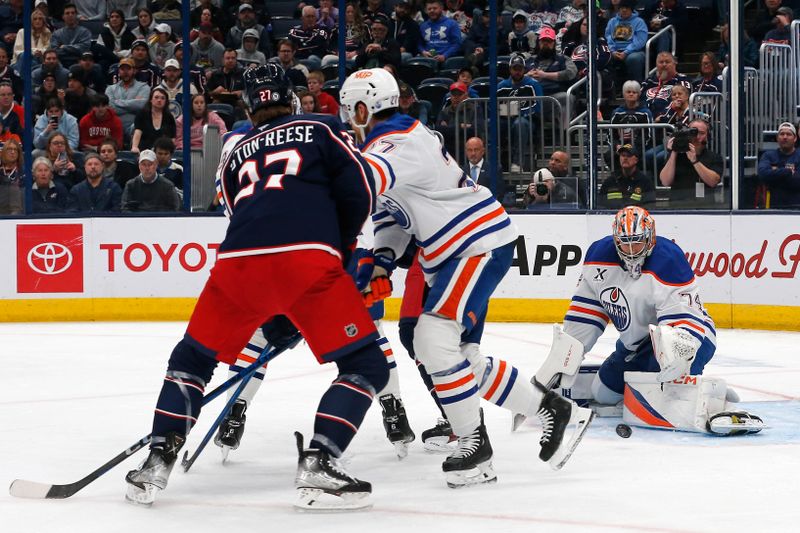 Oct 28, 2024; Columbus, Ohio, USA; Edmonton Oilers goalie Stuart Skinner (74) makes a save against the Columbus Blue Jackets during the second period at Nationwide Arena. Mandatory Credit: Russell LaBounty-Imagn Images