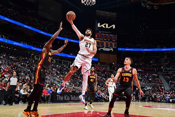 ATLANTA, GA - DECEMBER 11: Jamal Murray #27 of the Denver Nuggets shoots the ball during the game against the Atlanta Hawks on December 11, 2023 at State Farm Arena in Atlanta, Georgia.  NOTE TO USER: User expressly acknowledges and agrees that, by downloading and/or using this Photograph, user is consenting to the terms and conditions of the Getty Images License Agreement. Mandatory Copyright Notice: Copyright 2023 NBAE (Photo by Scott Cunningham/NBAE via Getty Images)