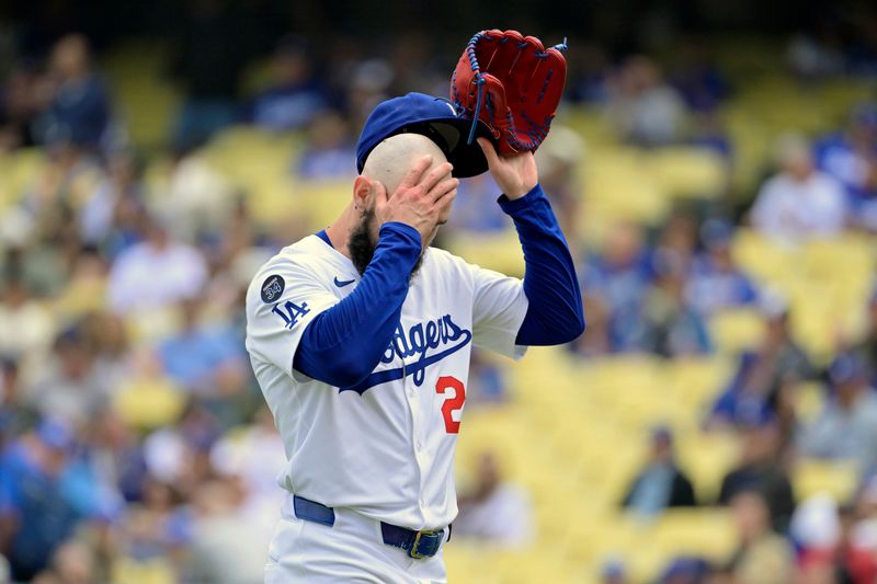 Apr 30, 2025; Los Angeles, California, USA; Los Angeles Dodgers starting pitcher Tony Gonsolin (26) reacts after a pitch against the Miami Marlins during the first inning at Dodger Stadium. Mandatory Credit: Jayne Kamin-Oncea-Imagn Images