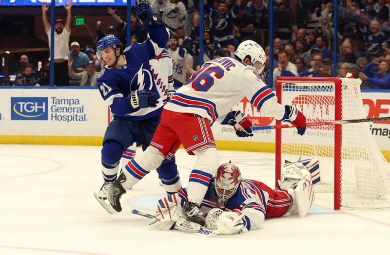 Mar 14, 2024; Tampa, Florida, USA; Tampa Bay Lightning center Brayden Point (21) scores a goal for his third goal of the game for a hat trick against the New York Rangers during the third period at Amalie Arena. Mandatory Credit: Kim Klement Neitzel-USA TODAY Sports