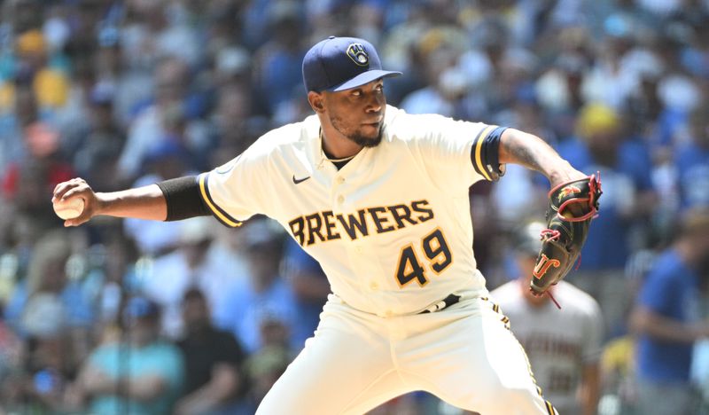 Jun 21, 2023; Milwaukee, Wisconsin, USA; Milwaukee Brewers starting pitcher Julio Teheran (49) delivers a pitch against the Arizona Diamondbacks in the first inning at American Family Field. Mandatory Credit: Michael McLoone-USA TODAY Sports