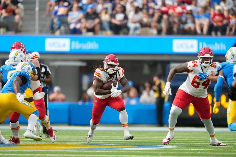 Kansas City Chiefs running back Clyde Edwards-Helaire (25) runs with the ball during the second half of an NFL football game against the Los Angeles Chargers Sunday, Sept. 29, 2024, in Inglewood, Calif. (AP Photo/Ashley Landis)