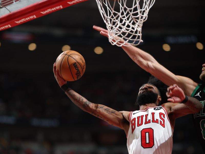 CHICAGO, IL - FEBRUARY 22: Coby White #0 of the Chicago Bulls drives to the basket during the game against the Boston Celtics on February 22, 2024 at United Center in Chicago, Illinois. NOTE TO USER: User expressly acknowledges and agrees that, by downloading and or using this photograph, User is consenting to the terms and conditions of the Getty Images License Agreement. Mandatory Copyright Notice: Copyright 2024 NBAE (Photo by Jeff Haynes/NBAE via Getty Images)