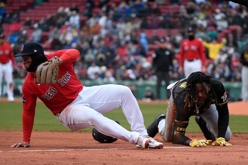 Apr 5, 2023; Boston, Massachusetts, USA; Pittsburgh Pirates shortstop Oneil Cruz (15) and Boston Red Sox third baseman Rafael Devers (11) collide at third base during the seventh inning at Fenway Park. Mandatory Credit: Eric Canha-USA TODAY Sports