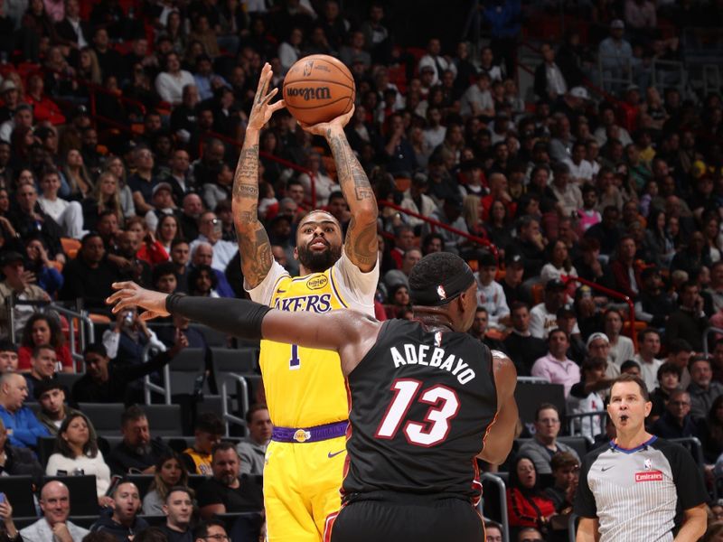 MIAMI, FL - DECEMBER 4:  D'Angelo Russell #1 of the Los Angeles Lakers shoots the ball during the game against the Miami Heat on December 4, 2024 at Kaseya Center in Miami, Florida. NOTE TO USER: User expressly acknowledges and agrees that, by downloading and or using this Photograph, user is consenting to the terms and conditions of the Getty Images License Agreement. Mandatory Copyright Notice: Copyright 2024 NBAE (Photo by Joe Murphy/NBAE via Getty Images)