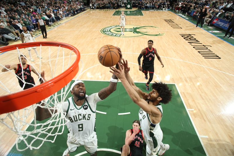 MILWAUKEE, WI - APRIL 5: Bobby Portis #9 of the Milwaukee Bucks goes up for the rebound during the game against the Toronto Raptors on April 5, 2024 at the Fiserv Forum Center in Milwaukee, Wisconsin. NOTE TO USER: User expressly acknowledges and agrees that, by downloading and or using this Photograph, user is consenting to the terms and conditions of the Getty Images License Agreement. Mandatory Copyright Notice: Copyright 2024 NBAE (Photo by Gary Dineen/NBAE via Getty Images).