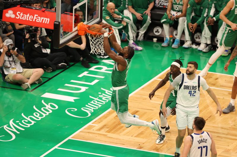 BOSTON, MA - JUNE 17: Jaylen Brown #7 of the Boston Celtics slam dunk the ball during the game  against the Dallas Mavericks during Game 5 of the 2024 NBA Finals on June 17, 2024 at the TD Garden in Boston, Massachusetts. NOTE TO USER: User expressly acknowledges and agrees that, by downloading and or using this photograph, User is consenting to the terms and conditions of the Getty Images License Agreement. Mandatory Copyright Notice: Copyright 2024 NBAE  (Photo by Stephen Gosling/NBAE via Getty Images)