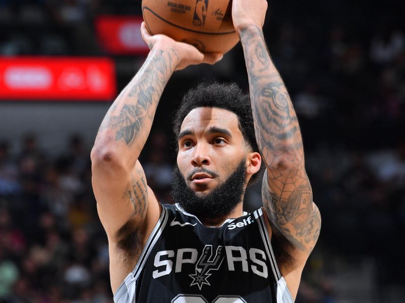 SAN ANTONIO, TX - APRIL 12:  Julian Champagnie #30 of the San Antonio Spurs shoots a free throw during the game on April 12, 2024 at the Frost Bank Center in San Antonio, Texas. NOTE TO USER: User expressly acknowledges and agrees that, by downloading and or using this photograph, user is consenting to the terms and conditions of the Getty Images License Agreement. Mandatory Copyright Notice: Copyright 2024 NBAE (Photos by Michael Gonzales/NBAE via Getty Images)