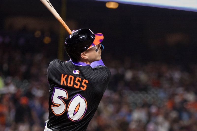 May 13, 2025; San Francisco, California, USA; San Francisco Giants second baseman Christian Koss (50) hits a single against the Arizona Diamondbacks during the fifth inning at Oracle Park. Mandatory Credit: John Hefti-Imagn Images