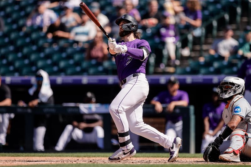 Aug 29, 2024; Denver, Colorado, USA; Colorado Rockies second baseman Brendan Rodgers (7) hits a two run home run in the fourth inning against the Miami Marlins at Coors Field. Mandatory Credit: Isaiah J. Downing-USA TODAY Sports