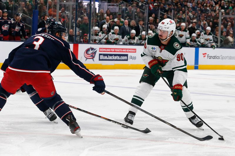 Oct 19, 2024; Columbus, Ohio, USA; Minnesota Wild left wing Marcus Johansson (90) wrists a shot on goal as Columbus Blue Jackets defenseman Jack Johnson (3) defends during the third period  at Nationwide Arena. Mandatory Credit: Russell LaBounty-Imagn Images