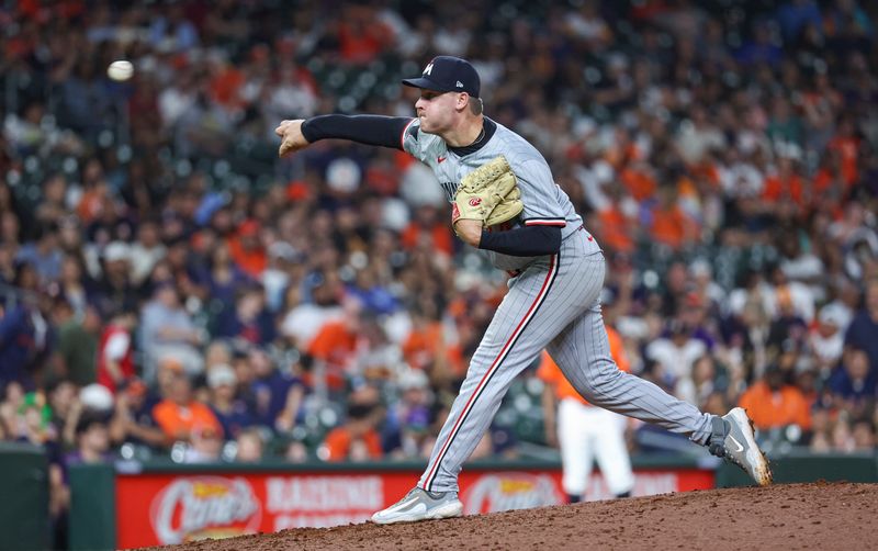 May 31, 2024; Houston, Texas, USA; Minnesota Twins relief pitcher Cole Sands (44) delivers a pitch during the ninth inning against the Houston Astros at Minute Maid Park. Mandatory Credit: Troy Taormina-USA TODAY Sports