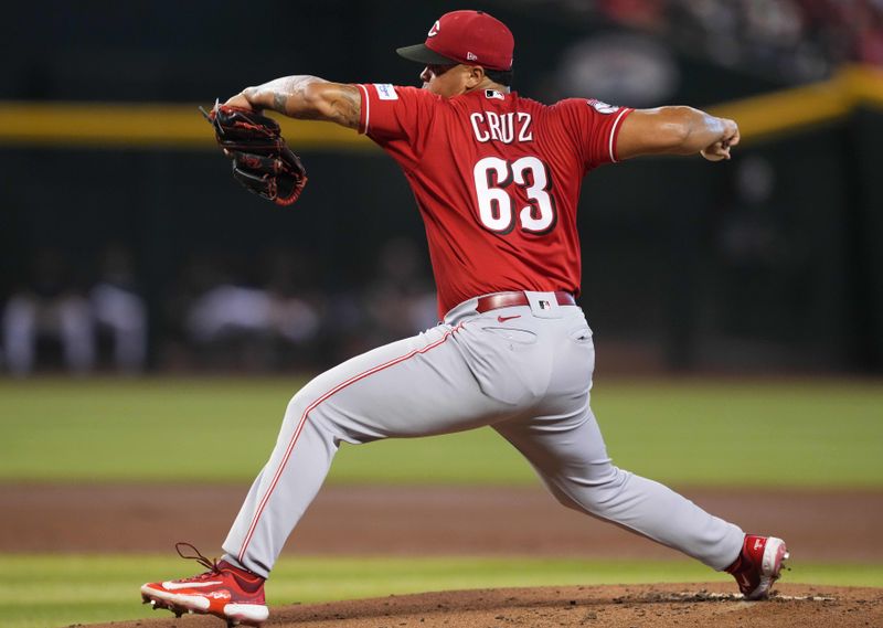 Aug 26, 2023; Phoenix, Arizona, USA; Cincinnati Reds starting pitcher Fernando Cruz (63) pitches against the Arizona Diamondbacks during the first inning at Chase Field. Mandatory Credit: Joe Camporeale-USA TODAY Sports