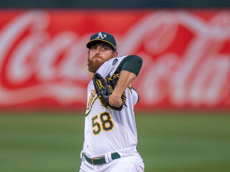 Sep 19, 2023; Oakland, California, USA; Oakland Athletics starting pitcher Paul Blackburn (58) delivers a pitch against the Seattle Mariners during the first inning at Oakland-Alameda County Coliseum. Mandatory Credit: Neville E. Guard-USA TODAY Sports