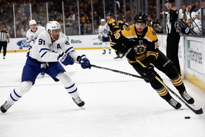 Oct 26, 2024; Boston, Massachusetts, USA; Boston Bruins right wing David Pastrnak (88) tries to get around Toronto Maple Leafs center John Tavares (91) during the first period at TD Garden. Mandatory Credit: Winslow Townson-Imagn Images