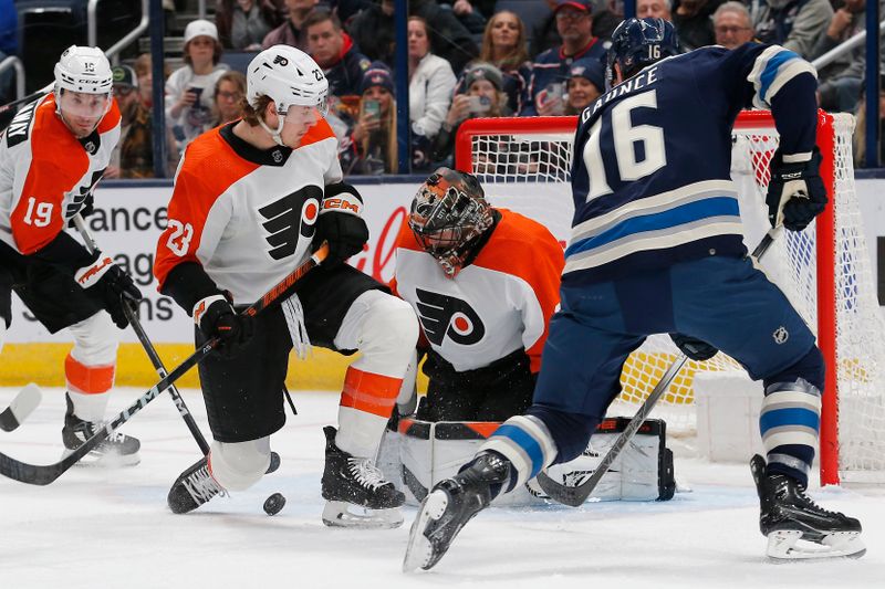 Apr 6, 2024; Columbus, Ohio, USA; Philadelphia Flyers goalie Samuel Ersson (33) makes a save as Columbus Blue Jackets center Brendan Gaunce (16) looks for a rebound during the first period at Nationwide Arena. Mandatory Credit: Russell LaBounty-USA TODAY Sports