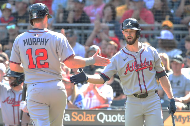 May 10, 2025; Pittsburgh, Pennsylvania, USA;  Atlanta Braves right fielder Eli White (right) greets catcher Sean Murphy (12) crossing home plate to score a run against the Pittsburgh Pirates during the second inning at PNC Park. Mandatory Credit: Charles LeClaire-Imagn Images
