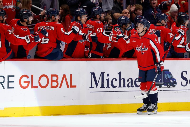 Oct 19, 2025; Washington, District of Columbia, USA; Washington Capitals right wing Ryan Leonard (9) celebrates with teammates after scoring a goal Vancouver Canucks during the second period at Capital One Arena. Mandatory Credit: Geoff Burke-Imagn Images
