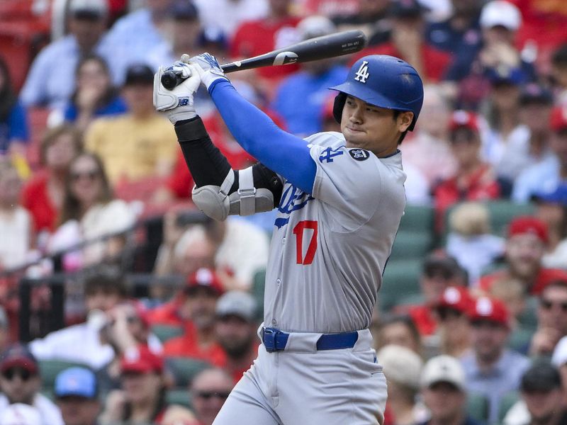 Jun 7, 2025; St. Louis, Missouri, USA;  Los Angeles Dodgers designated hitter Shohei Ohtani (17) hits a single against the St. Louis Cardinals during the ninth inning at Busch Stadium. Mandatory Credit: Jeff Curry-Imagn Images