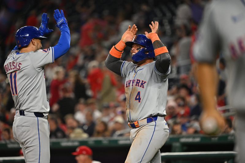 Jul 1, 2024; Washington, District of Columbia, USA; New York Mets second baseman Jose Iglesias (11) celebrates with catcher Francisco Alvarez (4) after hitting a home run against the Washington Nationals during the tenth inning at Nationals Park. Mandatory Credit: Rafael Suanes-USA TODAY Sports