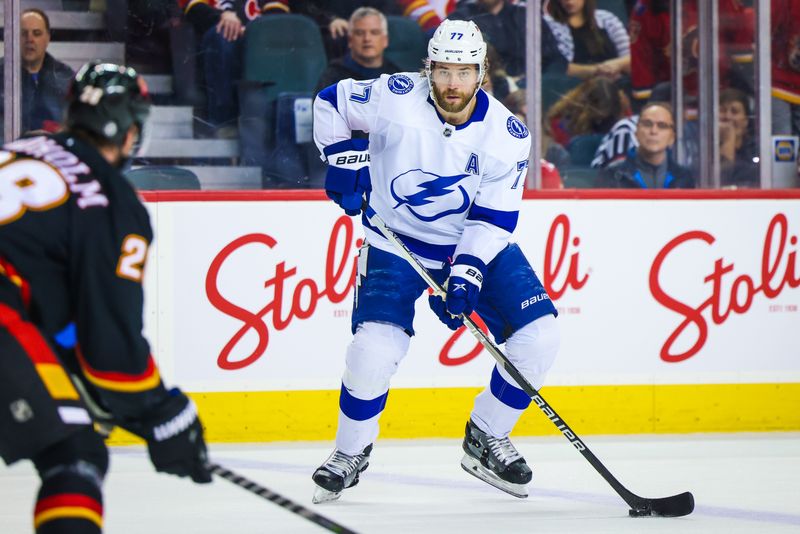 Jan 21, 2023; Calgary, Alberta, CAN; Tampa Bay Lightning defenseman Victor Hedman (77) controls the puck against the Calgary Flames during the first period at Scotiabank Saddledome. Mandatory Credit: Sergei Belski-USA TODAY Sports