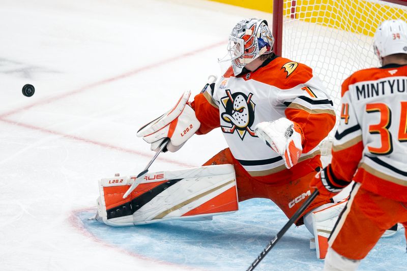 Oct 12, 2024; San Jose, California, USA;  Anaheim Ducks goaltender Lukas Dostal (1) deflects a shot on goal by the San Jose Sharks during the first period at SAP Center at San Jose. Mandatory Credit: D. Ross Cameron-Imagn Images