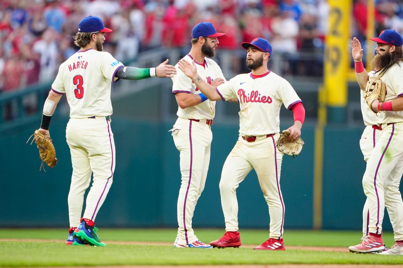 Sep 14, 2024; Philadelphia, Pennsylvania, USA; Philadelphia Phillies first baseman Bryce Harper (3) and center fielder Cal Stevenson (47) celebrate after defeating the New York Mets at Citizens Bank Park. Mandatory Credit: Gregory Fisher-Imagn Images