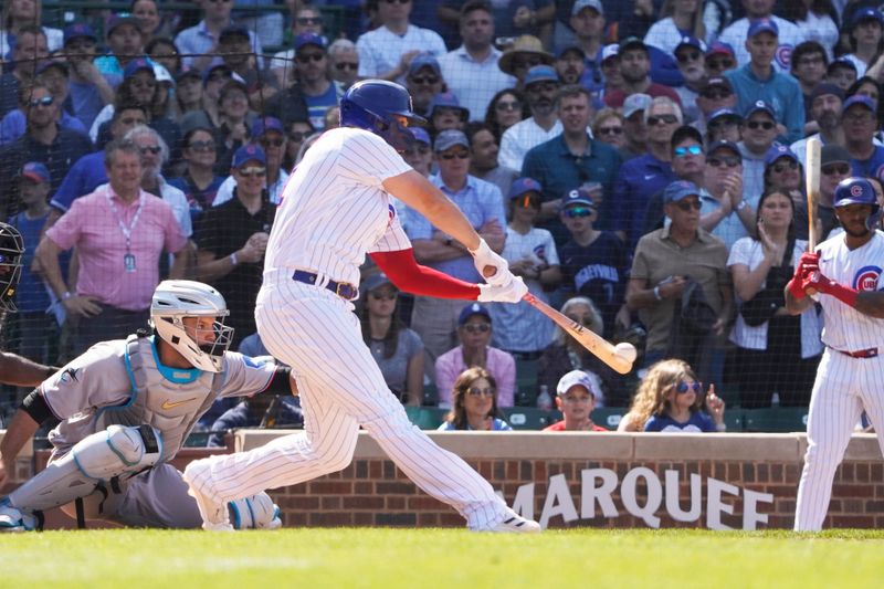 May 7, 2023; Chicago, Illinois, USA; Chicago Cubs designated Eric Hosmer (51) hits a one run single against the Miami Marlins during the ninth inning at Wrigley Field. Mandatory Credit: David Banks-USA TODAY Sports