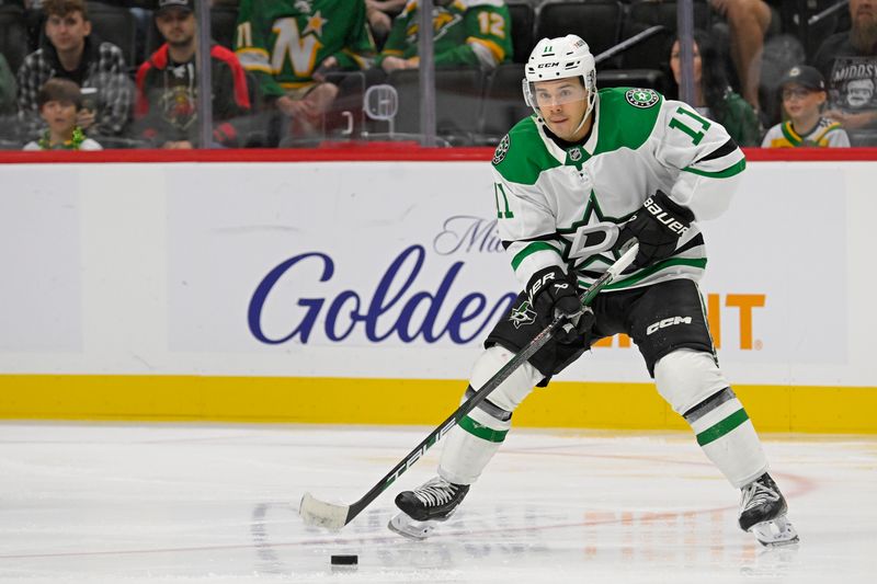 Sep 29, 2024; Saint Paul, Minnesota, USA;  Dallas Stars forward Logan Stankoven (11) controls the puck against the Minnesota Wild during the third period at Xcel Energy Center. Mandatory Credit: Nick Wosika-Imagn Images