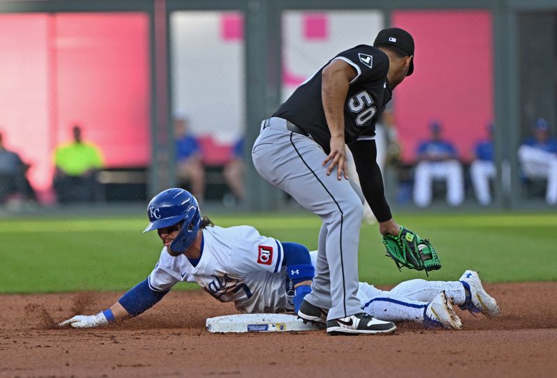 May 5, 2025; Kansas City, Missouri, USA;  Kansas City Royals shortstop Bobby Witt Jr. (7) steals second base in the first inning against Chicago White Sox second baseman Lenyn Sosa (50) at Kauffman Stadium. Mandatory Credit: Peter Aiken-Imagn Images