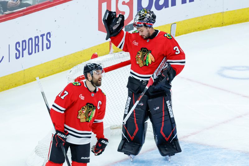 Dec 4, 2024; Chicago, Illinois, USA; Chicago Blackhawks goaltender Petr Mrazek (34) reacts after allowing a goal scored by Boston Bruins left wing Brad Marchand (not pictured) during the second period at United Center. Mandatory Credit: Kamil Krzaczynski-Imagn Images