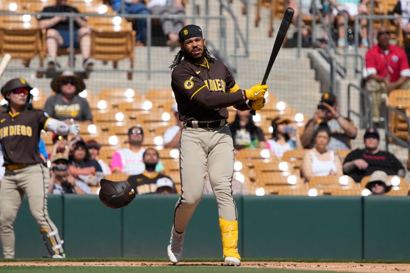 Feb 28, 2024; Phoenix, Arizona, USA; San Diego Padres designated hitter Luis Campusano (12) loses his helmet against the Chicago White Sox in the first inning at Camelback Ranch-Glendale. Mandatory Credit: Rick Scuteri-USA TODAY Sports