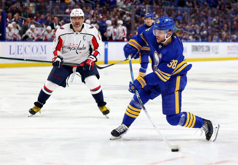 Apr 11, 2024; Buffalo, New York, USA;  Washington Capitals left wing Alex Ovechkin (8) watches as Buffalo Sabres defenseman Kale Clague (38) takes a shot on goal during the second period at KeyBank Center. Mandatory Credit: Timothy T. Ludwig-USA TODAY Sports