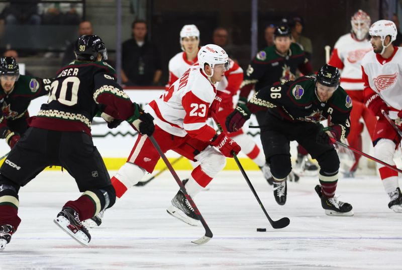 Jan 17, 2023; Tempe, Arizona, USA; Detroit Red Wings left wing Lucas Raymond (23) moves the puck against the Arizona Coyotes in the first period at Mullett Arena. Mandatory Credit: Mark J. Rebilas-USA TODAY Sports