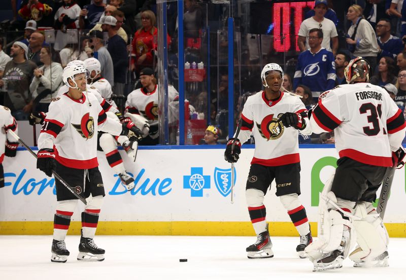 Apr 11, 2024; Tampa, Florida, USA; Ottawa Senators goaltender Anton Forsberg (31) is congratulated after they beat the Tampa Bay Lightning during a shoot out at Amalie Arena. Mandatory Credit: Kim Klement Neitzel-USA TODAY Sports