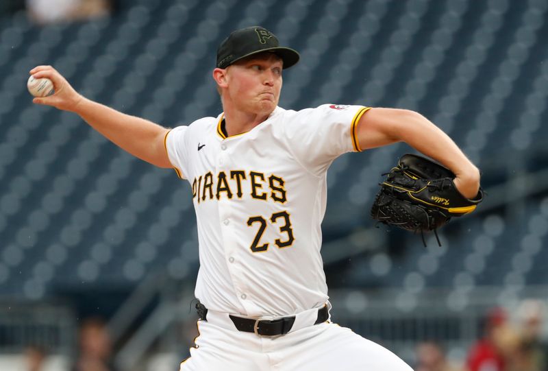 May 6, 2024; Pittsburgh, Pennsylvania, USA;  Pittsburgh Pirates starting pitcher Mitch Keller (23) delivers a pitch against the Los Angeles Angels during the first inning at PNC Park. Mandatory Credit: Charles LeClaire-USA TODAY Sports