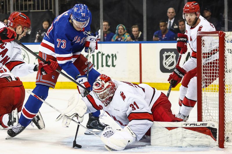 May 5, 2024; New York, New York, USA; Carolina Hurricanes goaltender Frederik Andersen (31) makes a save against New York Rangers center Matt Rempe (73) in game one of the second round of the 2024 Stanley Cup Playoffs at Madison Square Garden. Mandatory Credit: Wendell Cruz-USA TODAY Sports