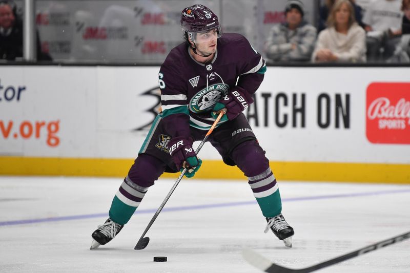 Dec 23, 2023; Anaheim, California, USA; Anaheim Ducks defenseman Jamie Drysdale (6) controls the puck against the Seattle Kraken during the second period at Honda Center. Mandatory Credit: Gary A. Vasquez-USA TODAY Sports