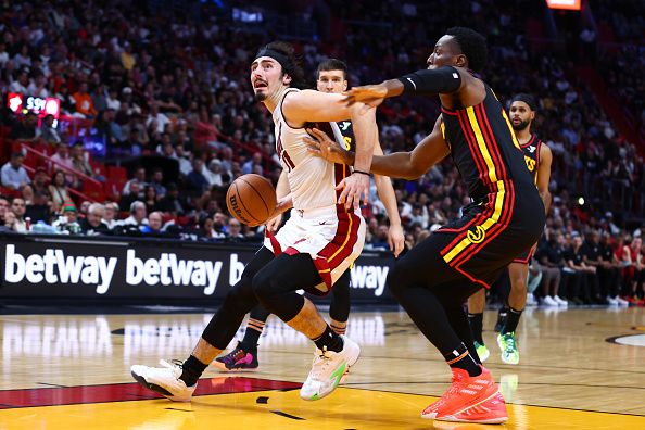 MIAMI, FLORIDA - DECEMBER 22: Jaime Jaquez Jr. #11 of the Miami Heat drives to the basket against the Atlanta Hawks during the third quarter of the game at Kaseya Center on December 22, 2023 in Miami, Florida. NOTE TO USER: User expressly acknowledges and agrees that, by downloading and or using this photograph, User is consenting to the terms and conditions of the Getty Images License Agreement. (Photo by Megan Briggs/Getty Images)