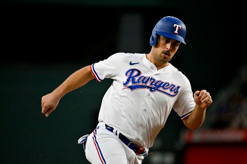 Aug 3, 2023; Arlington, Texas, USA; Texas Rangers first baseman Nathaniel Lowe (30) runs to third base during the third inning against the Chicago White Sox at Globe Life Field. Mandatory Credit: Jerome Miron-USA TODAY Sports