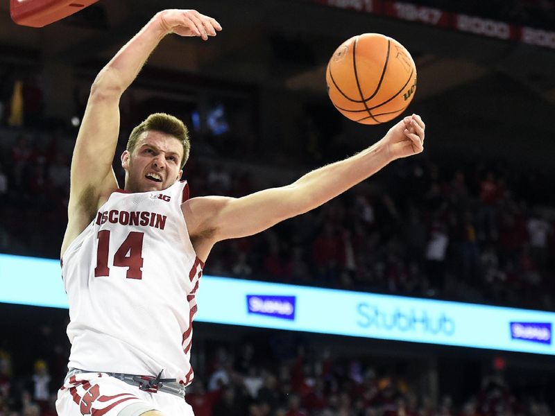 Jan 3, 2023; Madison, Wisconsin, USA; Wisconsin Badgers forward Carter Gilmore (14) dunks the ball against the Minnesota Golden Gophers during the second half at the Kohl Center. Mandatory Credit: Kayla Wolf-USA TODAY Sports